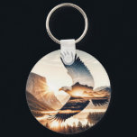 Soaring Bald Eagle Over Mountain Valley Lake Keychain<br><div class="desc">A bald eagle soars gracefully over a picturesque mountainous landscape at sunrise,  with a double-exposure effect,  and sun rays create a halo around the eagle,  adding a sense of majesty</div>