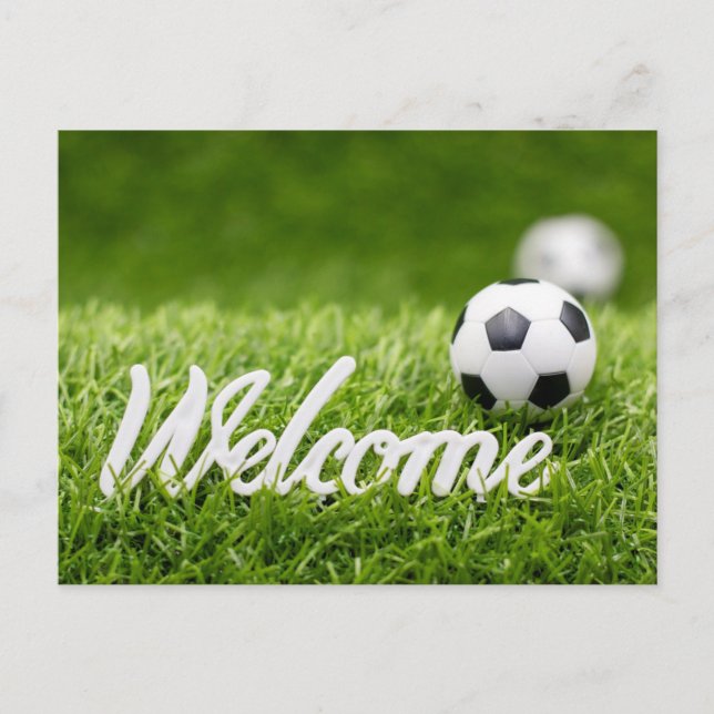 Soccer ball on green grass with welcome sign postcard (Front)