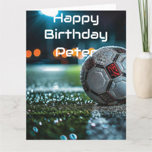 Soccer ball on the empty wet arena pitch card