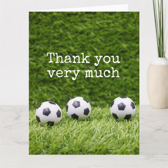 Soccer ball with word Thank you on green grass Card (Front)