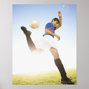 Soccer player jump kicking poster