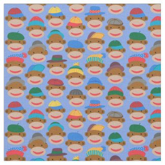 Sock Monkey Heads with caps on Blue Fabric