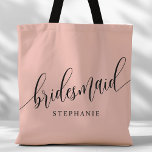 Soft Coral Pink Bridesmaid Modern Script Tote Bag<br><div class="desc">Show your appreciation to your bridal party with this stylish soft coral pink bridesmaid tote bag. Featuring modern script and customizable with your bridesmaid's name, this tote bag is both practical and elegant. The soft colour and chic design make it perfect for carrying wedding day essentials or everyday items. This...</div>