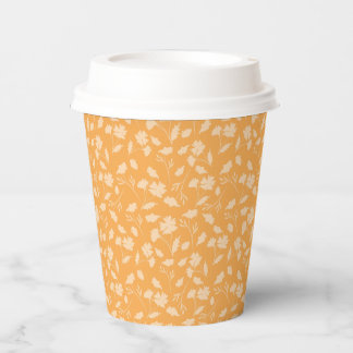 Soft floral pattern on orange background paper cups
