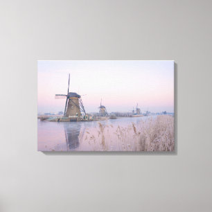Soft sunrise light in winter over windmills canvas print