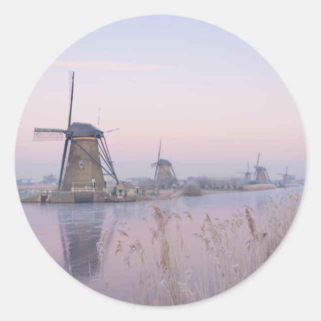 Soft sunrise light in winter over windmills classic round sticker (Front)