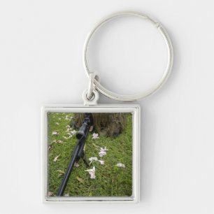 Soldier practices sniper tactics keychain