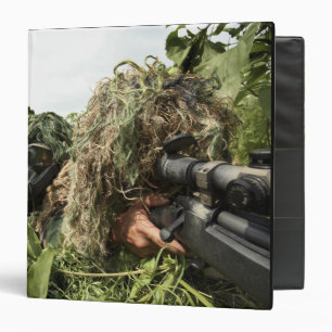 Soldiers dressed in ghillie suits binder