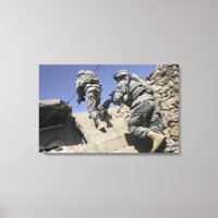 Soldiers running up staircase of a building