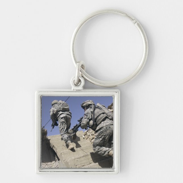 Soldiers running up staircase of a building keychain (Front)