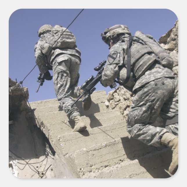 Soldiers running up staircase of a building square sticker (Front)