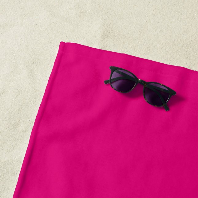 Solid deep pink beach towel (In Situ)