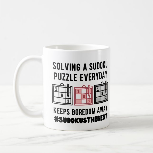 Solving a sudoku puzzle  everyday   coffee mug (Left)