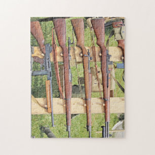 Some WWII Small Arms On A Rack Outside Jigsaw Puzzle