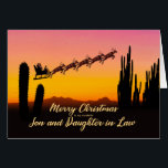 Son and Daughter in Law Christmas Santa Desert<br><div class="desc">A Christmas card for your son and daughter-in-law showing Santa flying over the desert. Lots of tall cactus are seen in silhouette. Wish a merry Christmas from the desert with a lovely sunset coloured card.</div>