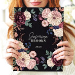 Sophisticated Dark Floral Custom Name Planner<br><div class="desc">This elegant design showcases a luxurious arrangement of florals in rich plum, cream, blush, and navy tones, set against a dramatic black background. The personalized name and year add a refined and unique touch, perfect for professionals, students, or anyone who loves classic and timeless floral art. Ideal for organizing tasks,...</div>