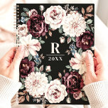 Sophisticated Dark Moody Floral Monogram Planner<br><div class="desc">This elegant design features a sophisticated floral wreath with rich blooms in shades of burgundy, blush, and cream, accented with soft greenery and berries. The dark black background enhances the timeless beauty of the arrangement, while the customizable monogram and year add a personal touch. Perfect for professionals, students, or anyone...</div>