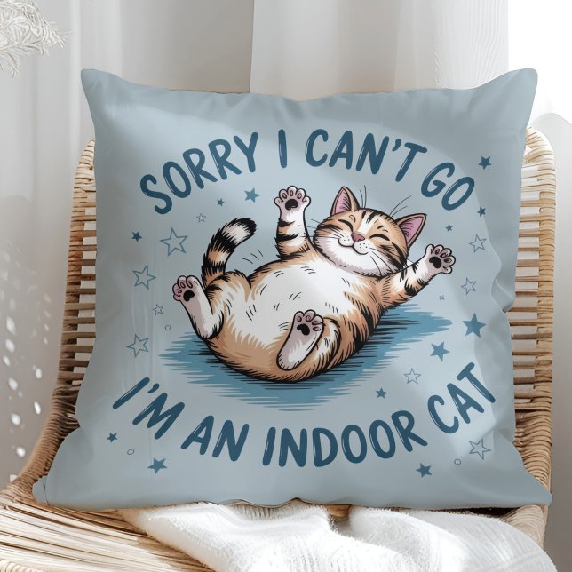 "Sorry I Can't Go, I'm an Indoor Cat" Funny Throw Pillow ("Sorry I Can't Go, I'm an Indoor Cat" Funny Throw Pillow in a sunny boho rattan chair.)