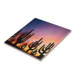 Southwestern Desert Landscape Cactus Sunrise Image Tile<br><div class="desc">Ceramic Tile printed with a Southwestern Desert Landscape Cactus Sunrise Image mixed media graphic art design illustration by TheFabricSeal at Zazzle #ZazzleMade https://www.zazzle.com/store/thefabricseal This gorgeous image design melds together a stunning sunrise sunset photo and beautiful desert landscape with a mountain range and majestic cactus silhouettes in the foreground. Pretty color...</div>