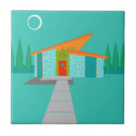Space Age Cartoon House Ceramic Tile<br><div class="desc">This Space Age Cartoon House Ceramic Tile is a retro lover’s dream come true. The minimalist art design features an aqua stone house with large, peacock blue windows. Hanging from the atomic, slanting, orange roof, a yellow sputnik light fixture illuminates the front door. The recessed red front door with starburst...</div>