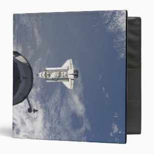 Space Shuttle Atlantis and a Russian spacecraft Binder