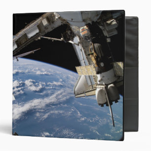 Space Shuttle Atlantis and a Soyuz spacecraft Binder