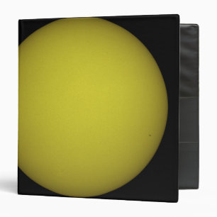 Space Shuttle Atlantis is seen in silhouette Binder