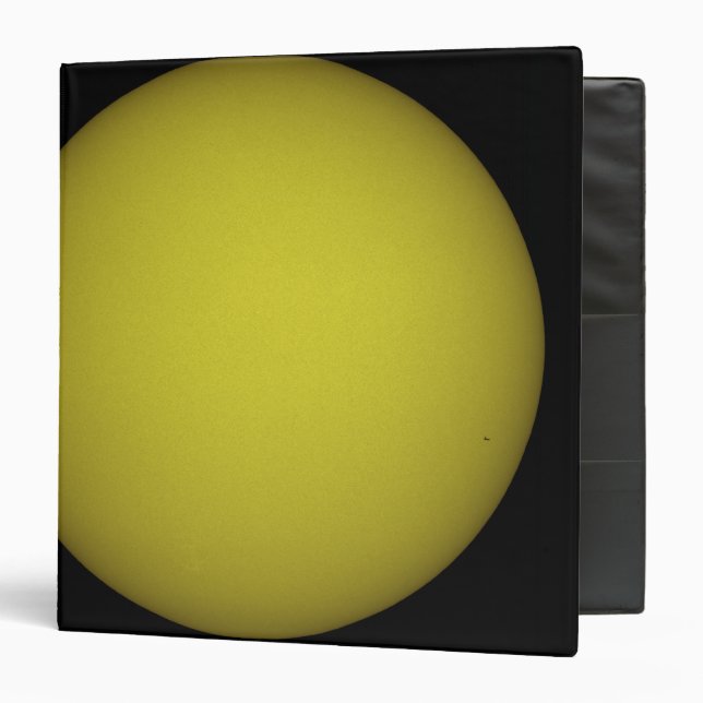 Space Shuttle Atlantis is seen in silhouette Binder (Front/Inside)