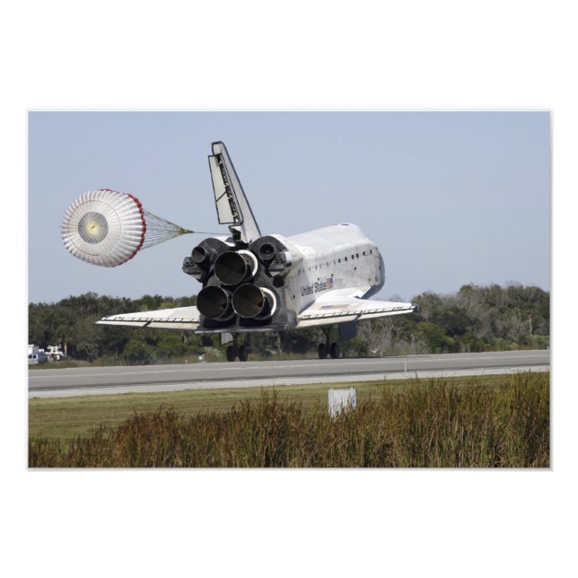 Space shuttle Atlantis unfurls its drag chute Photo Print (Front)