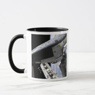 Space Shuttle Discovery docked Mug