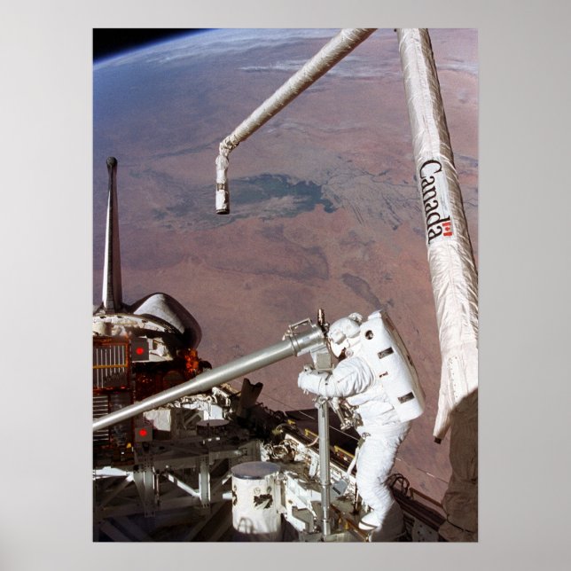 Spacewalk aboard Space Shuttle Columbia (STS-87) Poster (Front)