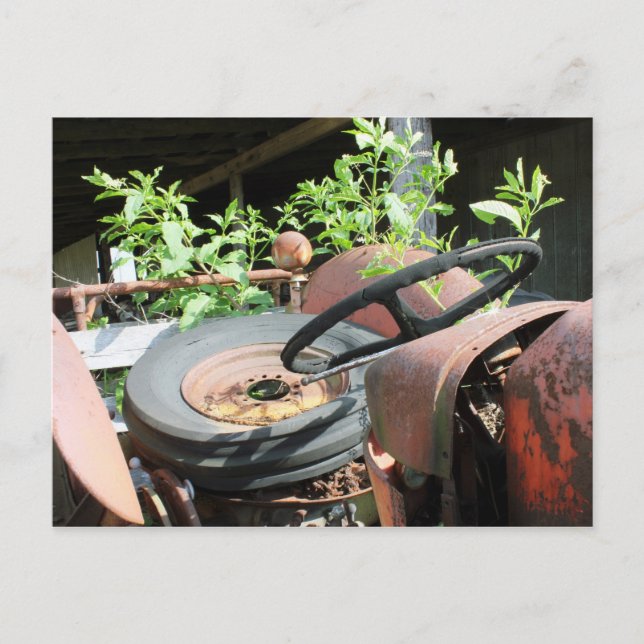 Spare Tire In The Seat Of A Scrap Tractor Postcard (Front)