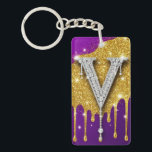 Sparkling Letter V With Gold Glitter Drip Keychain<br><div class="desc">Sparkling diamond-encrusted letter V set against a gold glitter field with dripping metallic effect and vivid purple background,  evoking luxury,  glam monogram style,  celebration and high-fashion bling.</div>