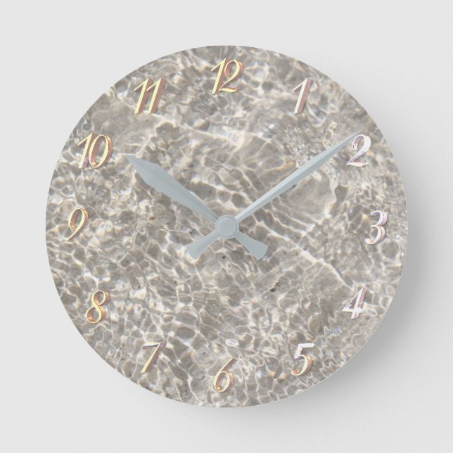Sparkling water on beach sand round clock (Front)