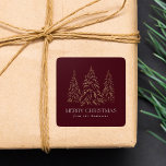 Sparkling Winter Pine Burgundy Merry Christmas Square Sticker<br><div class="desc">Elegant Christmas stickers featuring snowy faux gold foil pine trees with a burgundy background (or colour of your choice). "Merry Christmas" is displayed in a white, modern serif font with your name or custom text below. The personalized holiday stickers are perfect to use for sealing Christmas card envelopes, gift wrapping,...</div>