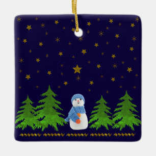 Sparkly gold stars, snowman and green tree on blue ceramic ornament