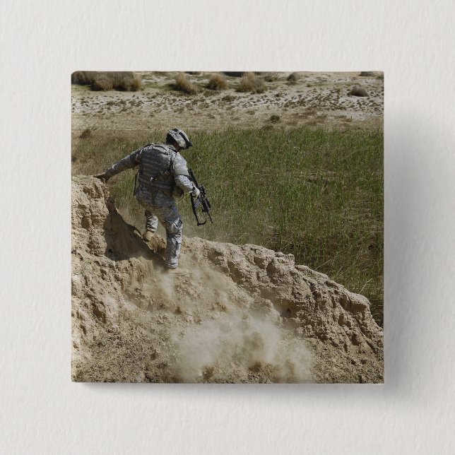 Specialist climbs down 2 inch square button (Front)