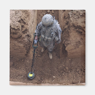 Specialist searches for a weapons cache magnet