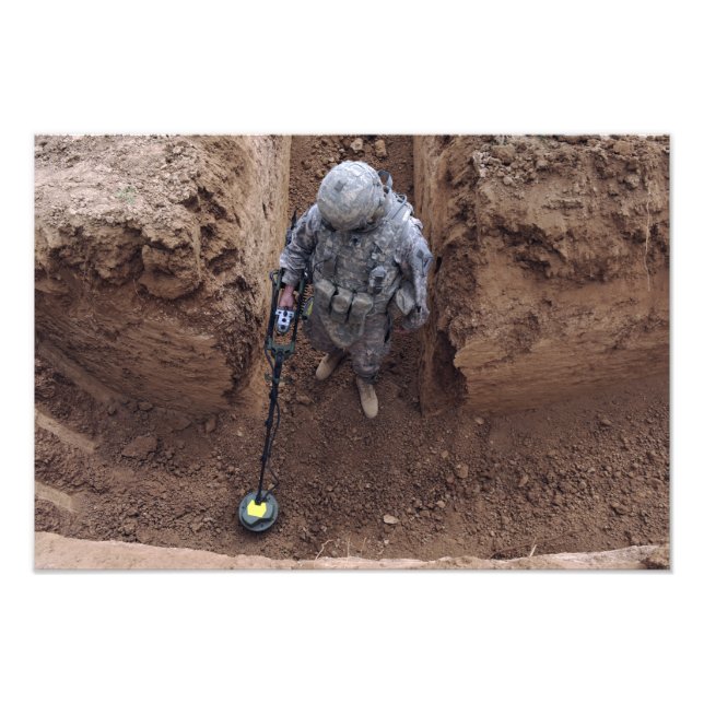 Specialist searches for a weapons cache photo print (Front)