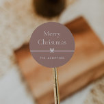 Spice | Modern Bow Simple Minimal Christmas Classic Round Sticker<br><div class="desc">Finish your holiday mailings and gifts with these sweet and simple Christmas stickers,  customizable with your preferred holiday greeting and family signature (shown with "Merry Christmas") on a soft earth tone terracotta background. A petite bow running through the centre completes this elegant minimalist holiday design.</div>
