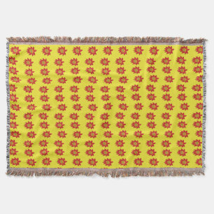 Spiky orange and red flower on yellow throw blanket