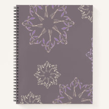 Spiral book with plant design.