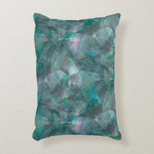 Spoted greenish cyan over unfinished wall plaster accent pillow