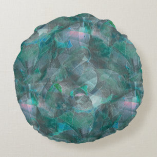 Spoted greenish cyan over unfinished wall plaster round pillow