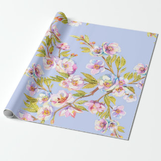 Sprigs of flowering apple or cherry trees on the b wrapping paper