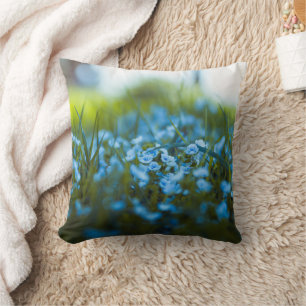 Spring flowers on field throw pillow