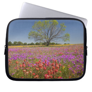 Spring mesquite trees growing in wildflowers, laptop sleeve