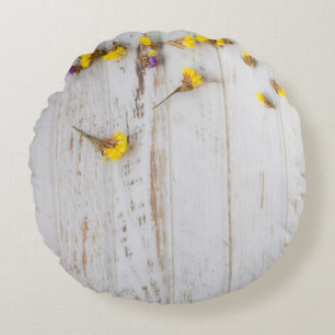 Spring yellow flowers, white plank decor. round pillow