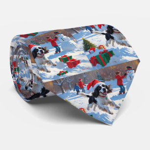 Springer Spaniel Running Snow with Christmas Hat Tie