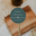 Spruce | Modern Bow Simple Minimal Christmas Classic Round Sticker<br><div class="desc">Finish your holiday mailings and gifts with these sweet and simple Christmas stickers,  customizable with your preferred holiday greeting and family signature (shown with "Merry Christmas") on a soft spruce green background. A petite bow running through the centre completes this elegant minimalist holiday design.</div>